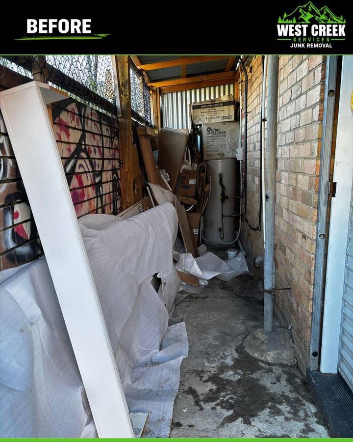 Before: Narrow walkway packed with boxes and wrapping