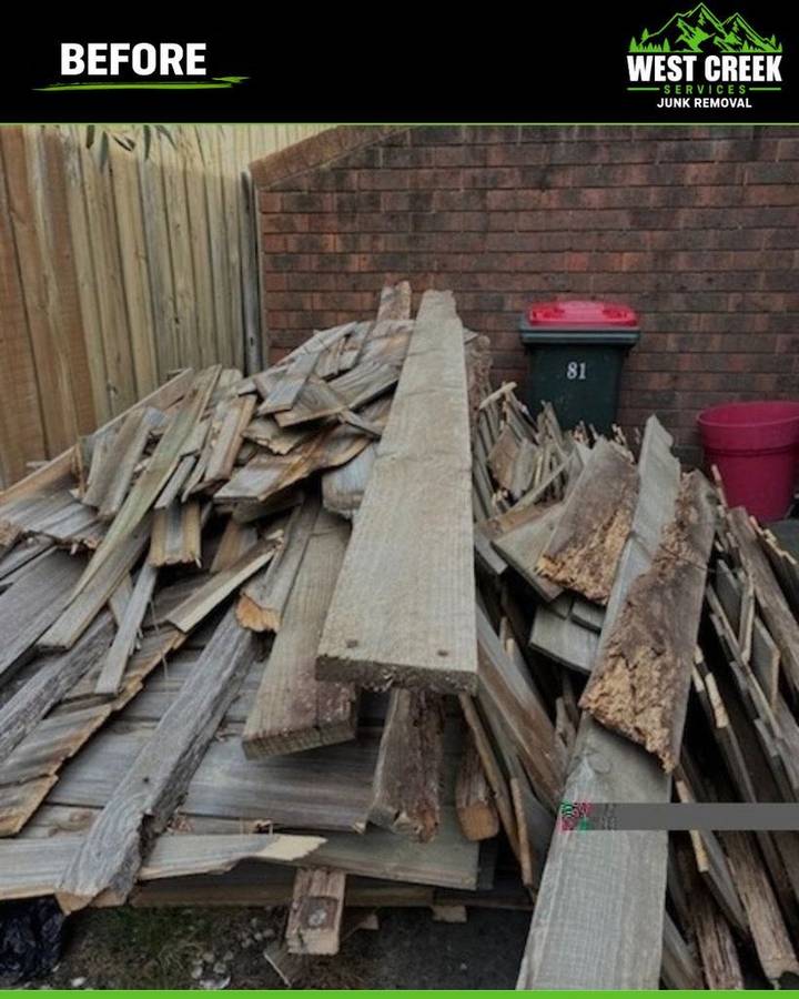 Before: Large pile of old fence palings